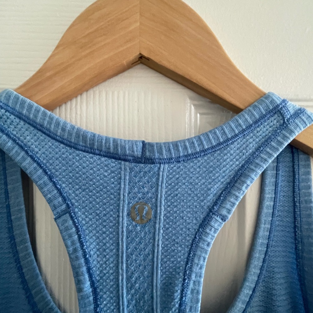 Lululemon Blue Racerback Tank Top possible minor fading on neck, see photos.